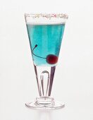 Azure cocktail in glass on white background