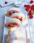 Raspberry and strawberry Swiss roll on plate
