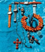 Various jewellery and watches from coral and turquoise