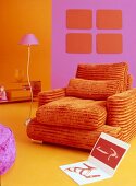 Orange armchair with foam padding in living room