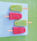 Homemade melon ice cream in green and red colour arranged on blue plate