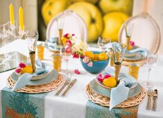 Close-up of table laid with summer decorations