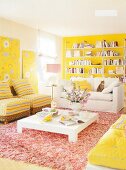 Living room with yellow painted walls, sofa, armchairs and fur carpet