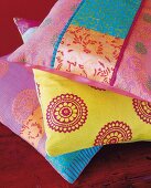 Close-up of colourful cushion covers with silk patchwork