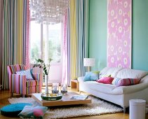 Living room with white sofa, striped curtains and open balcony door