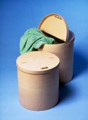 Beech wooded laundry baskets made of blue background