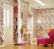 View of hall with red chair, two small white dogs and floral pattern wallpaper