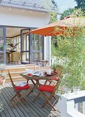 Terrace with wooden table and chair