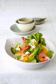 Avocado thymain salad and shrimp in white bowl