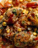 Close-up of creole chicken with maque choux