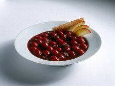 Cherry soup with raisins on plate