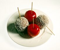 Skewered apples on plate