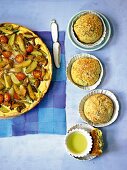 Potato tart with tomatoes and mushrooms served with potato rolls