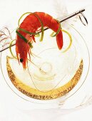 Shrimp wrapped in lemon peel over glass of champagne, overhead view