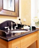 Antique sink with black marble and shelf