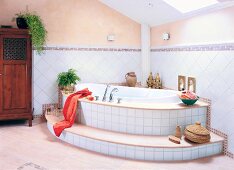 Bathroom in beige and white with luxury bathtub