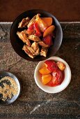 Plums schmarrn in bowl on table, overhead view