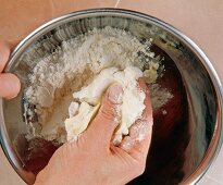 Souffle cream flour knead in steel bowl