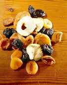 Close-up of dried plums, apples and figs