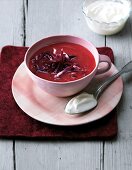 Beetroot soup with ginger in pink cup