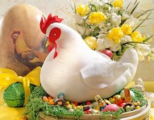 White stitched chicken and Easter sweets in basket