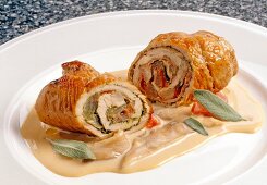 Close-up of turkey roulade with oyster, mushroom and sage filling on plate