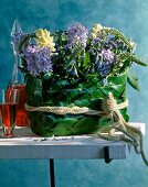 Bouquet of hyacinths and Lysimachus clethroides on table