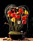 Heart shaped flower arrangement with horsetails and Iceland poppy