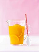 Close-up of apricot orange crush in carafe