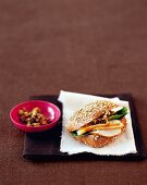 Wholemeal bread with chicken breast on napkin