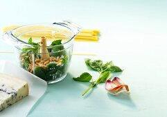 Salad leaves and pine nuts in a glass bowl
