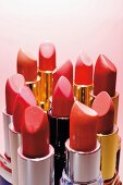 Close-up of various lipsticks in different shades of red