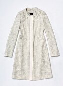 Close-up of silk coat on white background