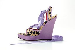 Purple wedge heel on white background