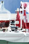 Sour cherry liqueur, blackcurrant and sweet-sour cherries in jars and bottles