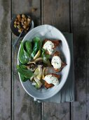 Turkey medallions and roasted salad in bowl