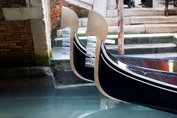 Close-up of tip of Gondola with ornate decoration at Venice, Italy