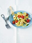 Spaghetti with cherry tomatoes, parsley and sheep's cheese