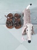 Pair of children shoes with knitted dog