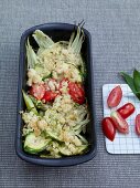 Spring vegetables with wild garlic crumble, tomatoes and zucchini in serving bowl