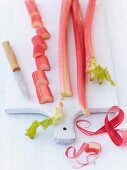 Chopped rhubarbs on chopping board for rhubarb tartlets