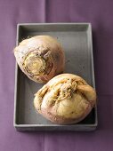 Raw turnips on tray, overhead view
