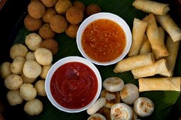 Pancake rolls and dips at Dhigufinolhu Island in Maldives, overhead view