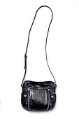 Black handbag with riverts and zipper on white background