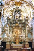 People in Rococo style chapel in Regensburg, Bavaria, Germany