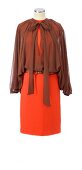 Brown chiffon blouse and orange sheath dress on mannequin against white background