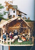 Close-up of handmade Christmas crib with puppets