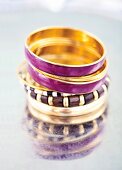 Close-up of purple bangles on white background