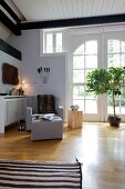 View of renovated country style house with hallway and white double doors