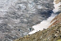 Hikers in Aletsch Glacier, Marjelesee, Valais, Switzerland